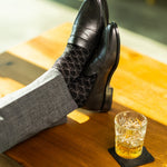 The Black & Silver Lattice men's dress sock — black sock with a silver lattice pattern lifestyle image
