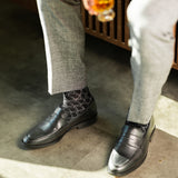 The Black & Silver Lattice men's dress sock — black sock with a silver lattice pattern lifestyle image