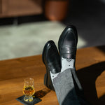 The Grey Nested Diamonds men's dress sock — grey sock with black nested diamonds lifestyle image