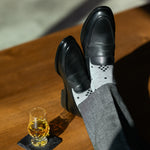 The Grey Nested Diamonds men's dress sock — grey sock with black nested diamonds lifestyle image
