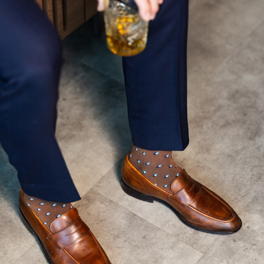 The Mocha Gemstones men's dress sock — mocha sock with navy, white & powder blue gemstones lifestyle image
