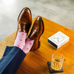 Heathered pink men's dress socks with a fuchsia flower pattern