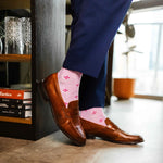 Heathered pink men's dress socks with a fuchsia flower pattern