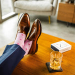 Heathered pink men's dress socks with a fuchsia flower pattern