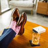 Heathered pink men's dress socks with a fuchsia flower pattern