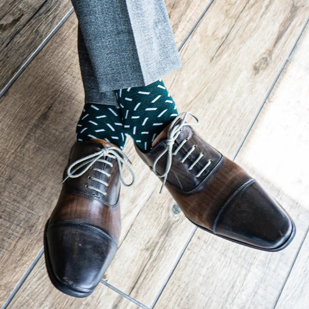 Hunter green men's dress sock with a contrasting sprinkle pattern