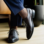 A mocha mousse sock with navy T-Suns