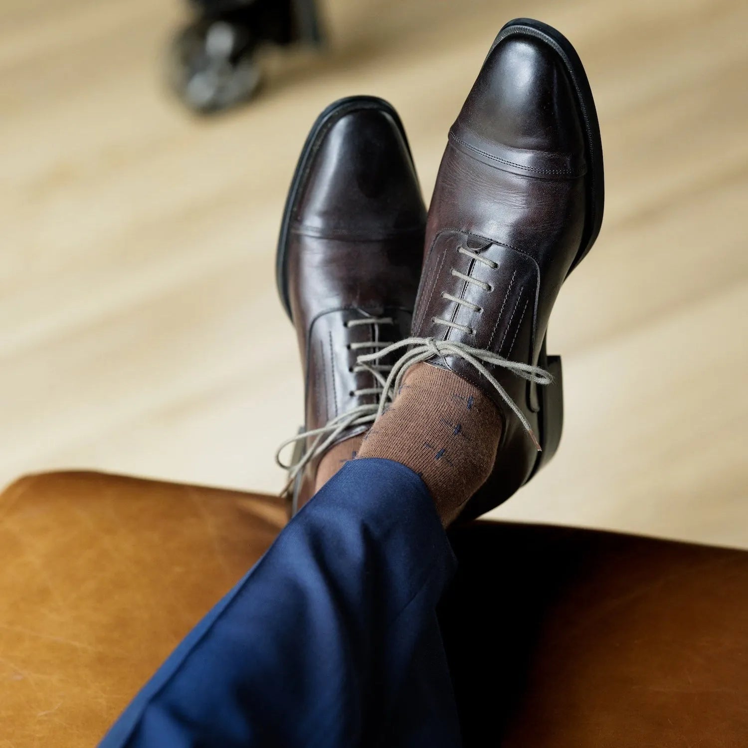 A mocha mousse sock with navy T-Suns