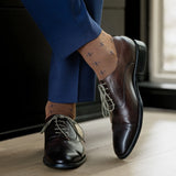 A mocha mousse sock with navy T-Suns