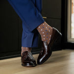 A mocha mousse brown men's dress sock with white and navy triangles