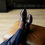 A mocha mousse brown men's dress sock with white and navy triangles