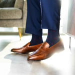 Navy blue men's sock with a garnet red flower pattern