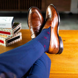 Navy blue men's sock with a garnet red flower pattern