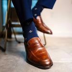 Navy men's dress socks with a gold flower pattern
