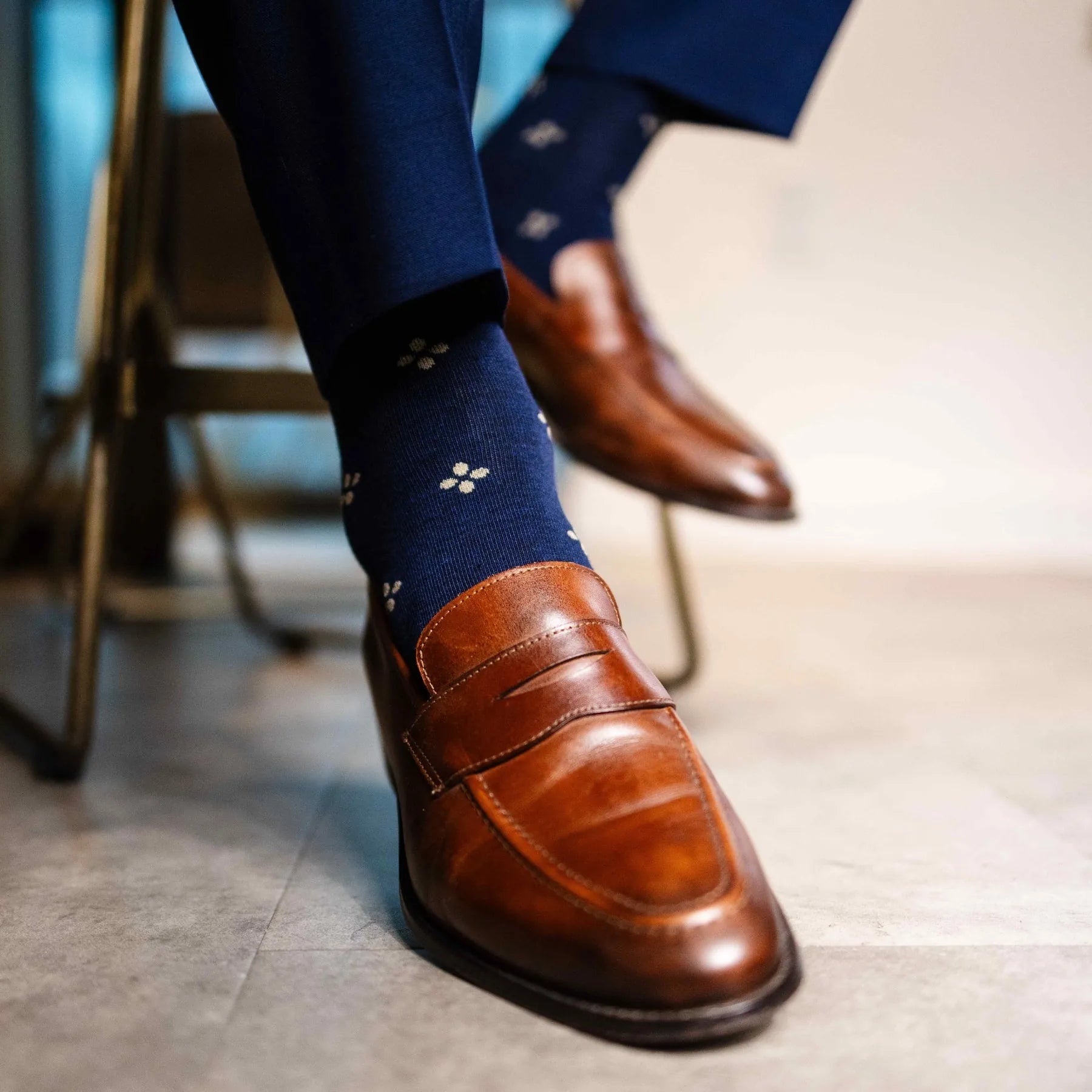 Navy men's dress socks with a gold flower pattern