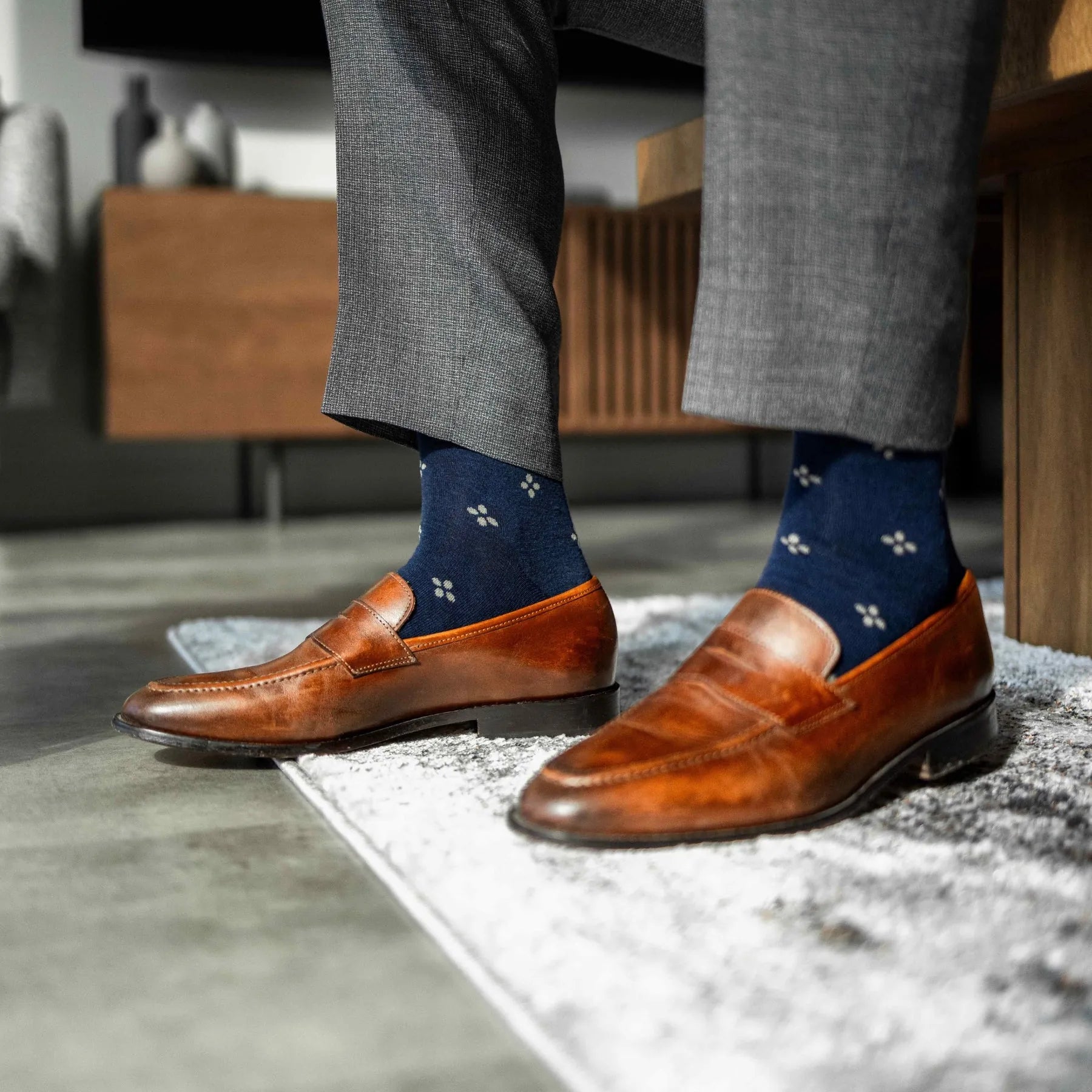 Navy men's dress socks with a gold flower pattern