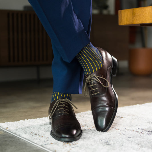 A Navy Blue men's dress Sock with a Yellow Ribbed pattern