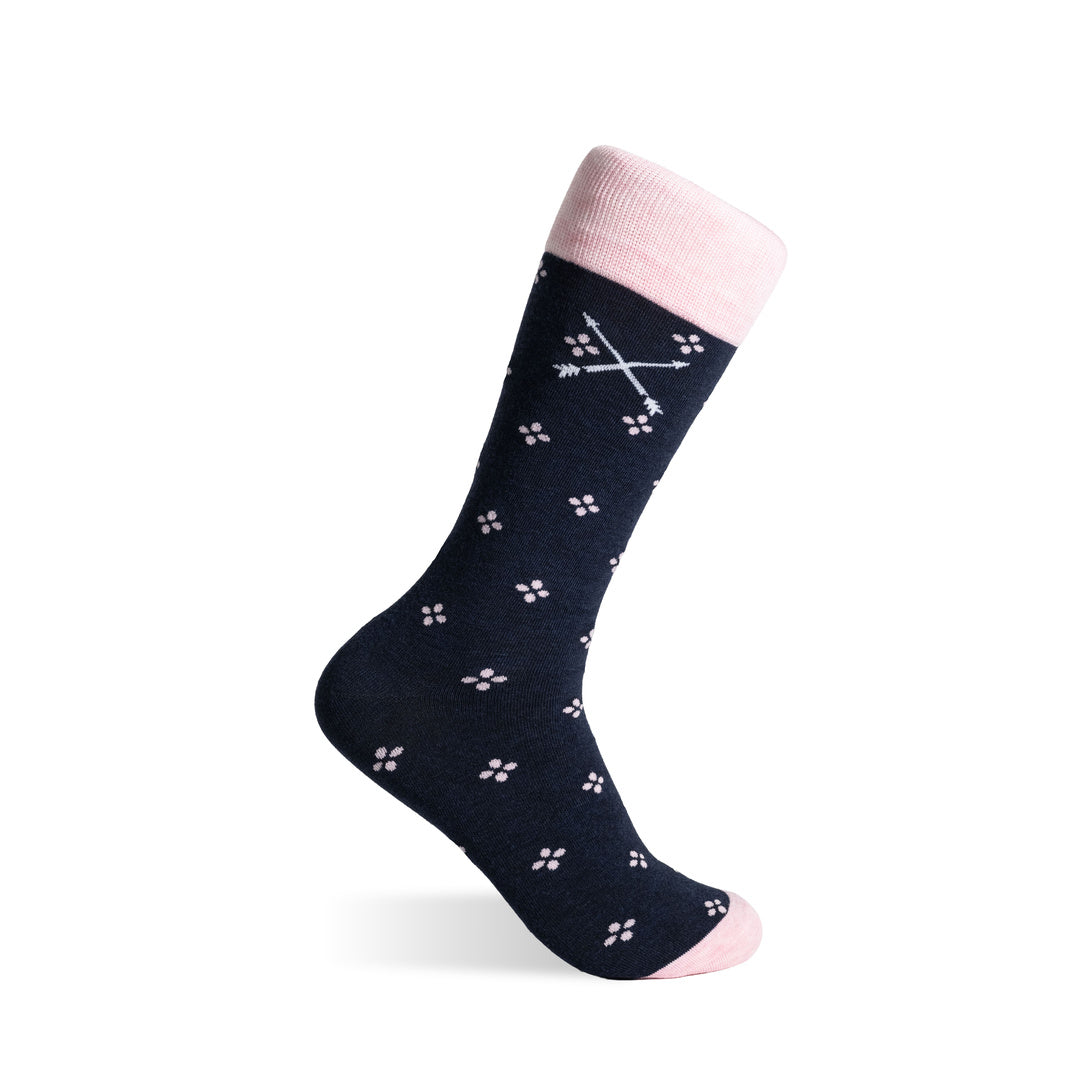 Navy crew sock with blush pink floral pattern, contrasting cuff and embroidered logo.