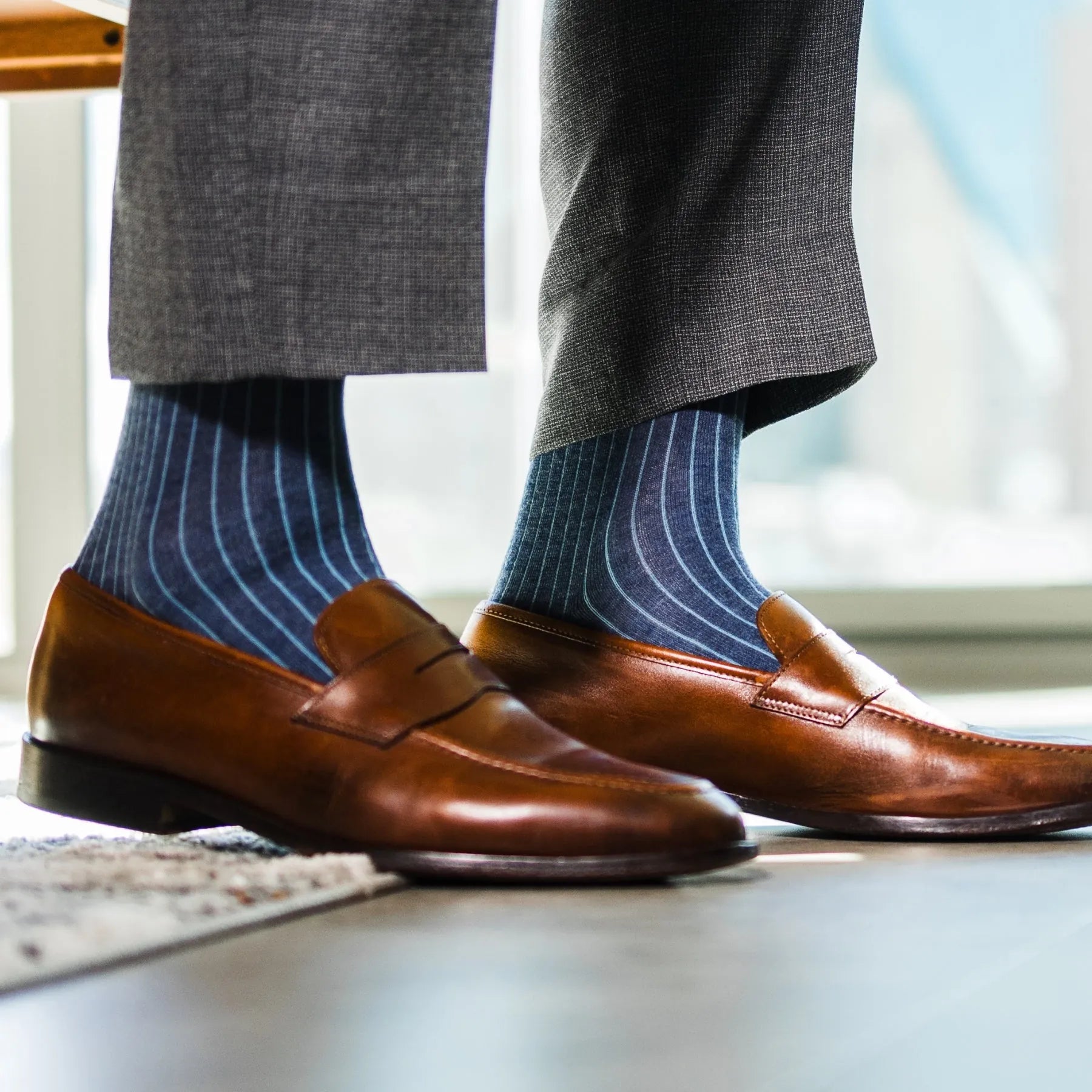 A Prussian Blue men's dress sock with an Arctic Blue Ribbed Pattern