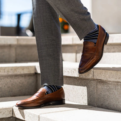 The Alvarados - A Blue, Black and White Striped Sock