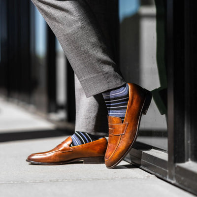 The Alvarados - A Blue, Black and White Striped Sock