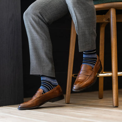 The Alvarados - A Blue, Black and White Striped Sock