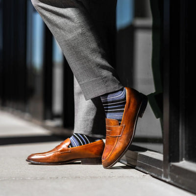 The Alvarados - A Blue, Black and White Striped Sock