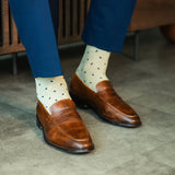 Understated and versatile, The Ashburys pair a crisp ivory base with deep navy micro-tiles for a modern twist on a timeless palette. Clean, confident, and endlessly wearable, this pair elevates minimalism with texture.