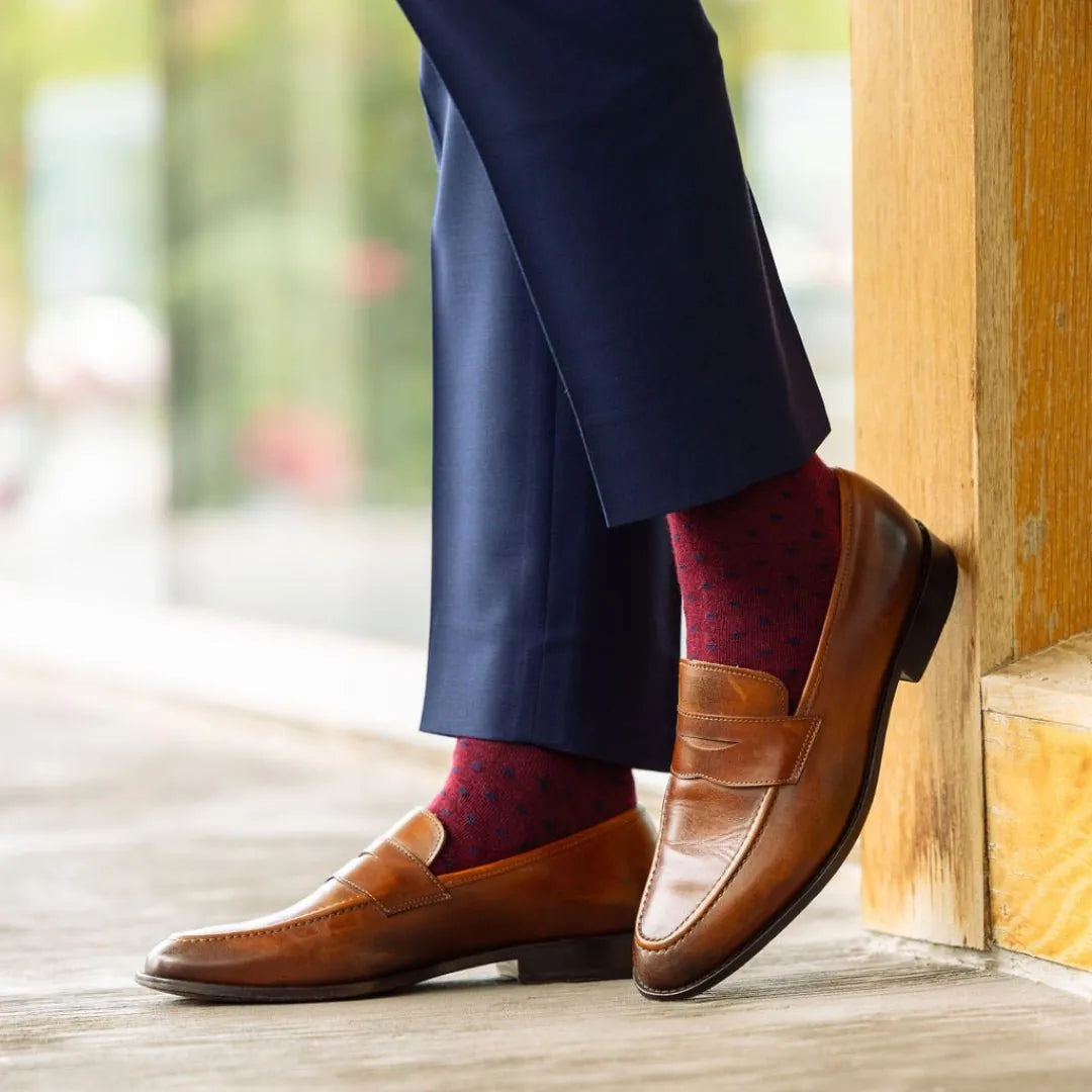 deep red men's dress sock with navy blue polkadots