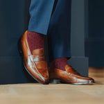 deep red men's dress sock with navy blue polka dots