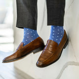 Man wearing heathered blue men's dress sock with ocean blue micro squares with grey slacks and brown shoes