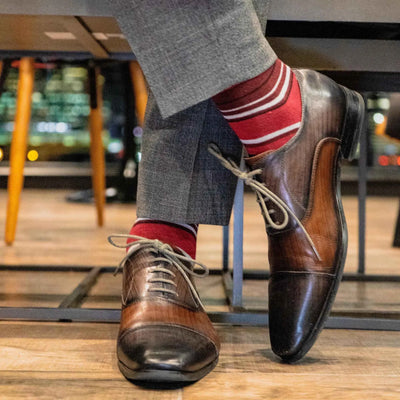 The Colpinis - A Red, White, and Black Striped Sock