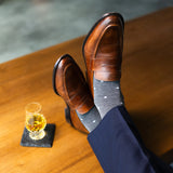 grey men's dress socks with a pale blue diamond pattern