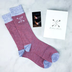 A pair of salmon and blue textured men's socks.