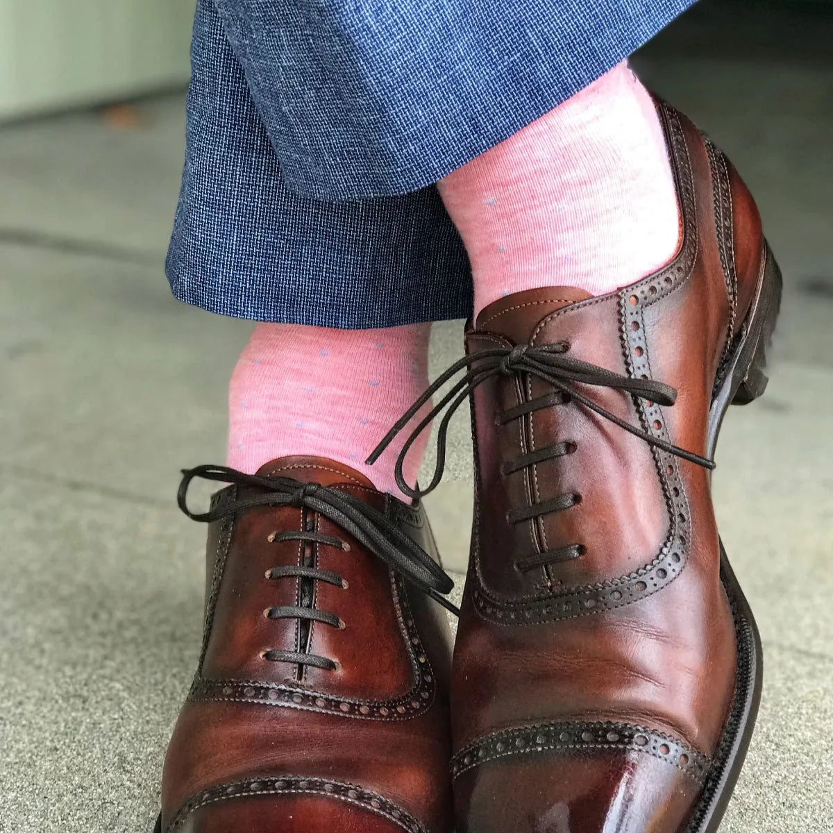 Guy wearing awesome pink socks and blue pants