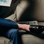 Guy wearing cool socks and blue pants