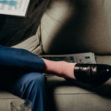 Guy wearing cool socks and blue pants