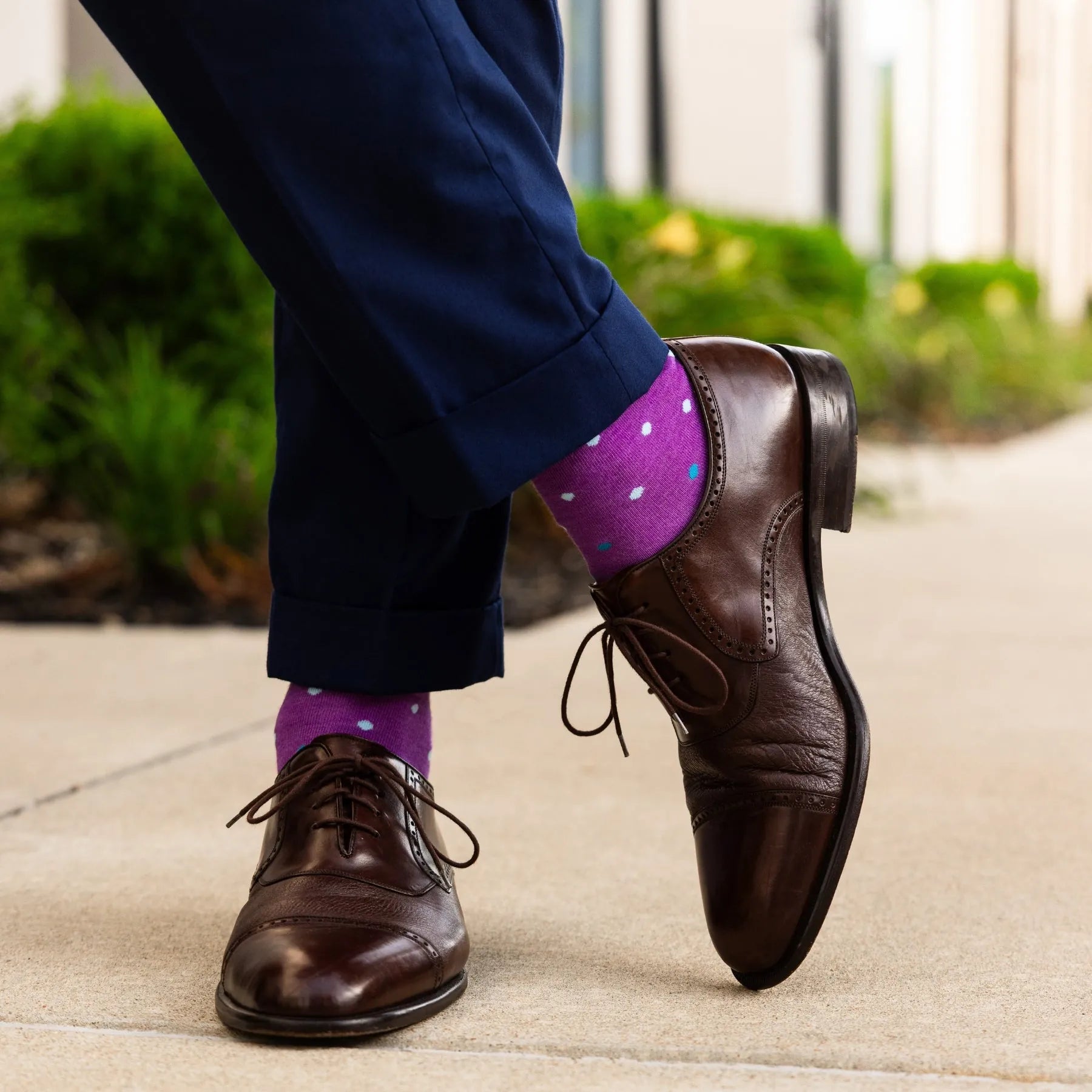 vibrant purple men's dress socks with multi-colored polka dot pattern