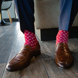 Raspberry red men's dress sock with white sprinkles pattern