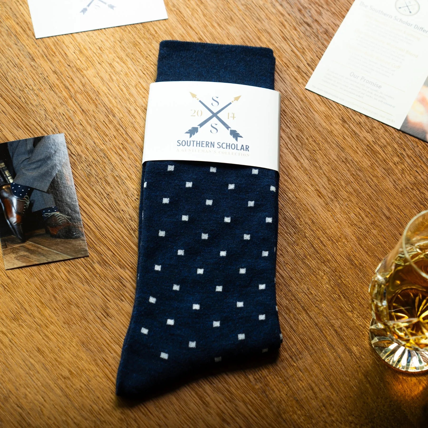 Navy blue men's patterned dress socks with white dots