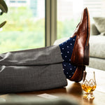 Navy blue men's patterned dress socks with white dots