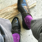 Man wearing purple dress socks with white hatches and dress shoes