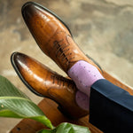 Guy wearing a periwinkle men's dress sock with navy and baby blue pin dots