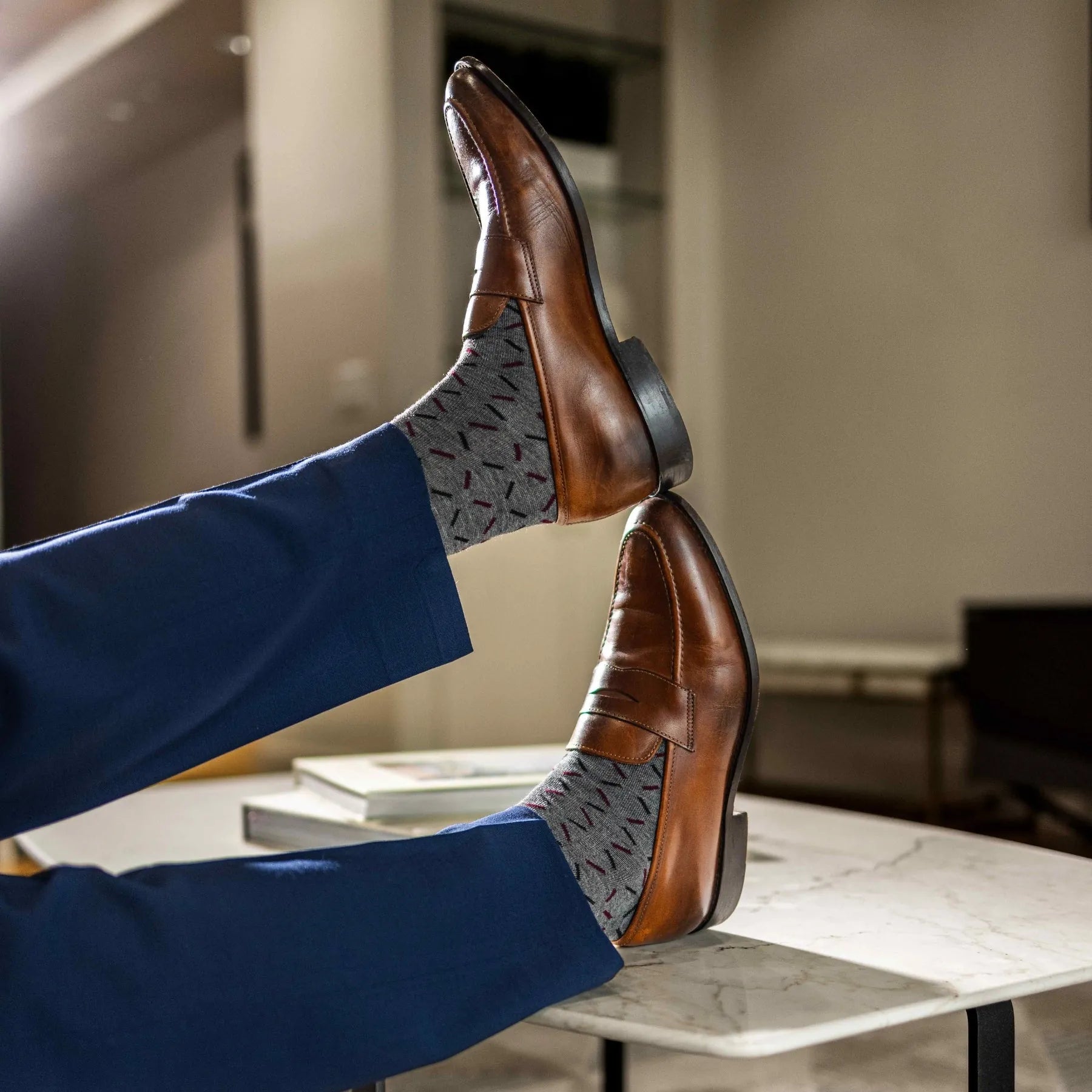 Grey men's dress sock with red and black x pattern