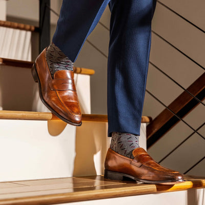 The Neufelds - A Grey Sock With a Deep Red & Black X Pattern