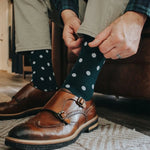 Man wearing green socks with white polka dots