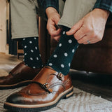 Man wearing green socks with white polka dots