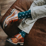 Man wearing green socks with white polka dots