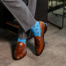 light blue men's dress socks with a black horseshoe pattern