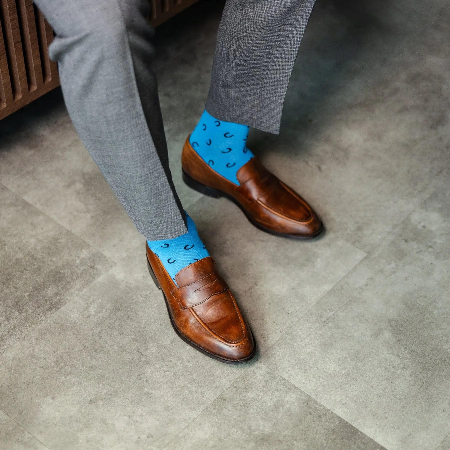 The Penchins - A Sky Blue Sock with Black Horseshoes Mid-Calf